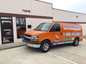 911 Restoration mold removal van in front of a commercial property